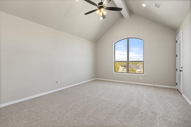 carpeted empty room featuring ceiling fan and vaulted ceiling with beams