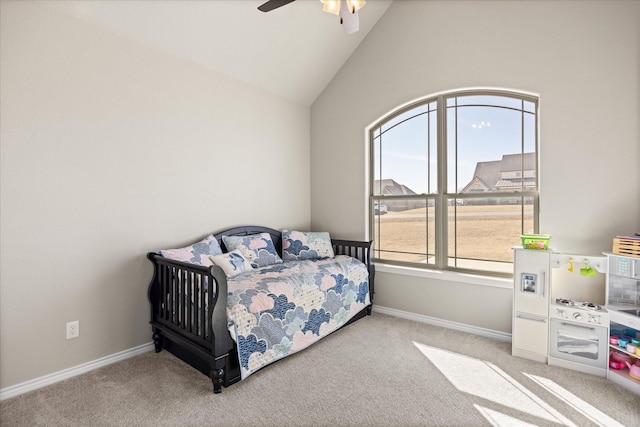 bedroom featuring ceiling fan, light colored carpet, and lofted ceiling