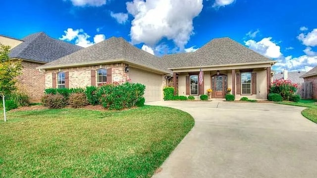 view of front facade with a garage and a front lawn