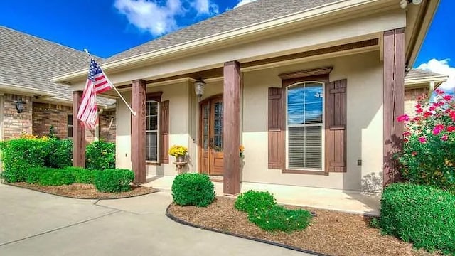 doorway to property featuring covered porch