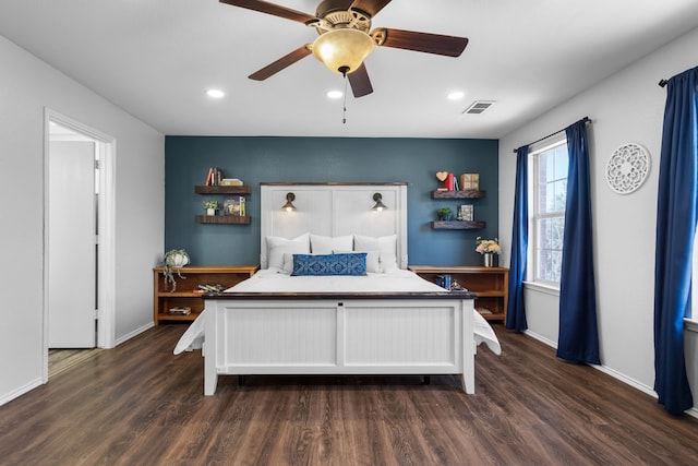 bedroom with ceiling fan and dark wood-type flooring