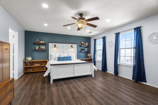 bedroom featuring dark hardwood / wood-style floors and ceiling fan