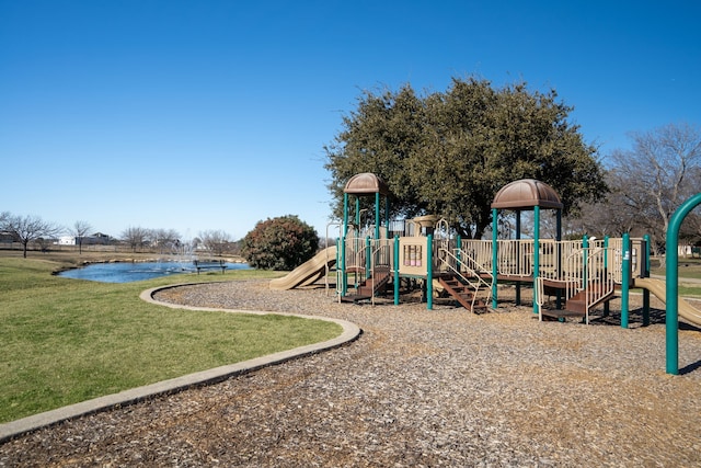 view of jungle gym featuring a yard and a water view