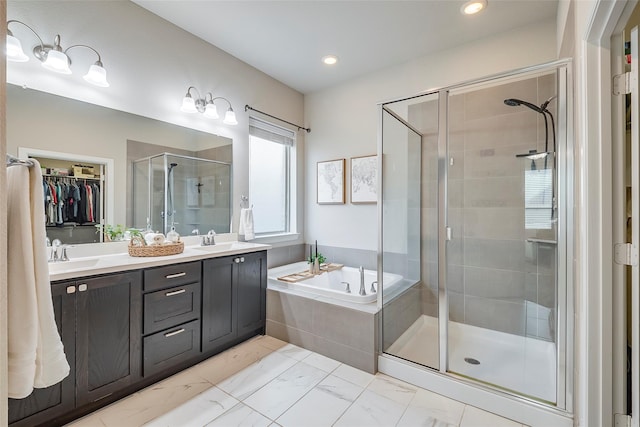 bathroom featuring vanity and separate shower and tub