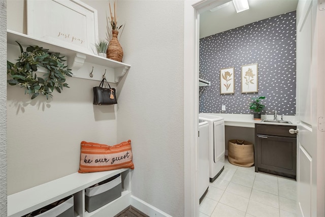 laundry room featuring sink, separate washer and dryer, and light tile patterned flooring