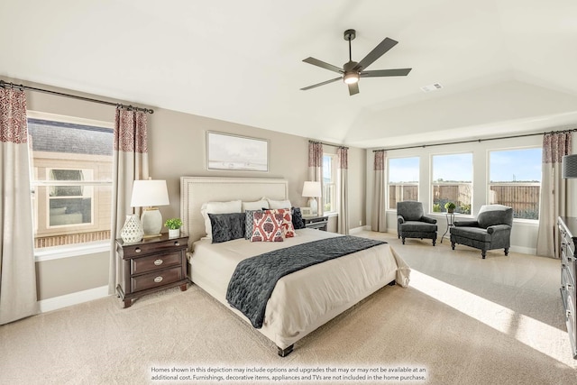 bedroom with ceiling fan, light colored carpet, and vaulted ceiling