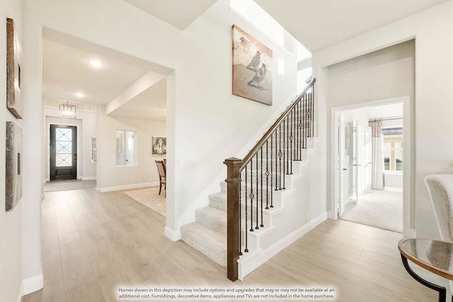 entryway with light hardwood / wood-style floors