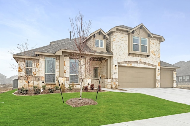 craftsman-style house with a garage and a front lawn