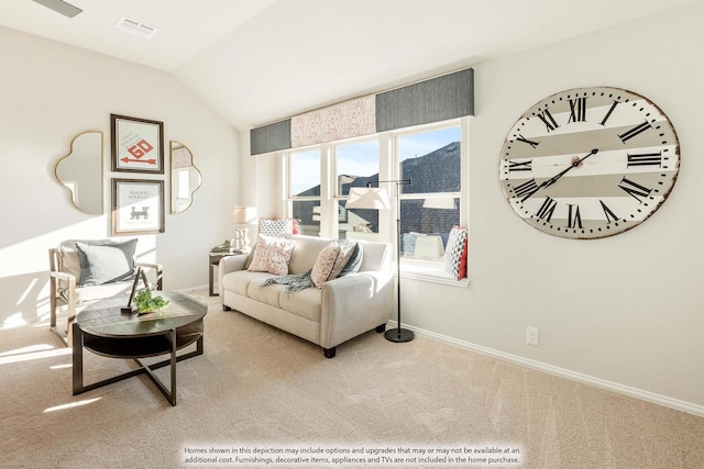 carpeted living room featuring lofted ceiling