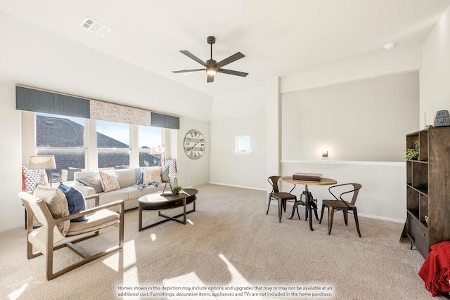 carpeted living room with ceiling fan