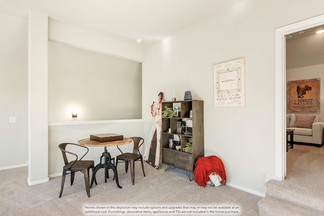 dining room with light colored carpet