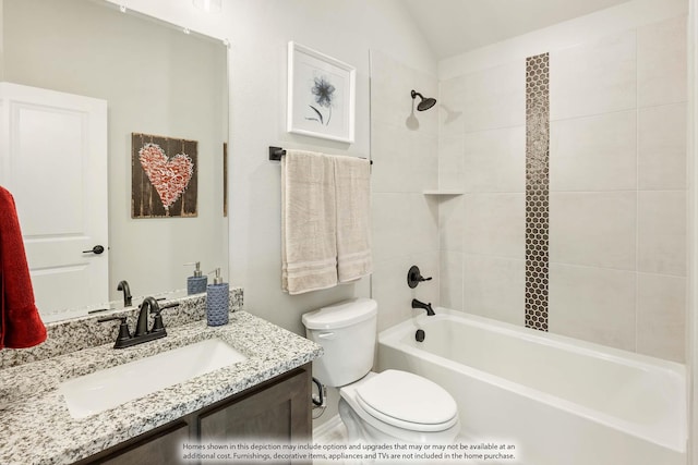 full bathroom featuring vanity, toilet, and tiled shower / bath combo