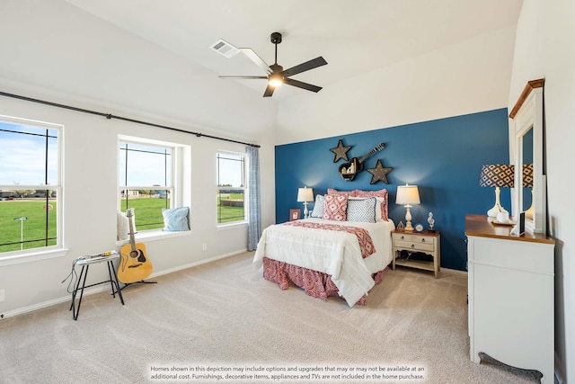 carpeted bedroom featuring ceiling fan and vaulted ceiling