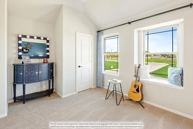 living area with light carpet and lofted ceiling