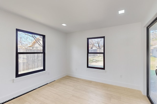 unfurnished room featuring light wood-type flooring