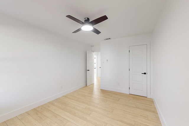 empty room with light hardwood / wood-style floors and ceiling fan