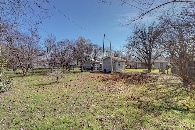 view of yard featuring a storage unit