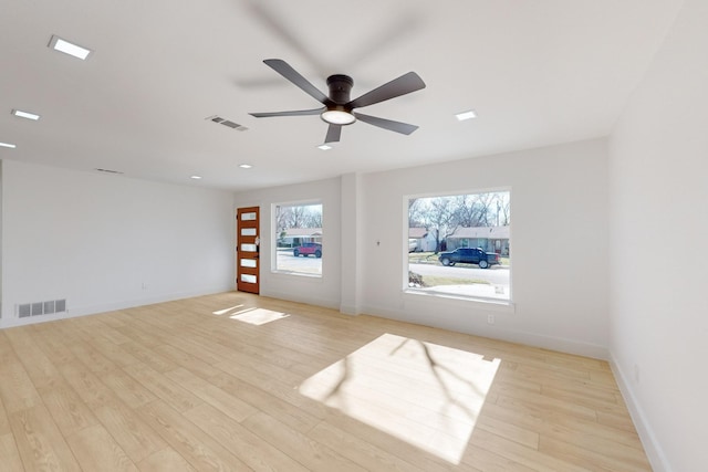 unfurnished room featuring ceiling fan and light wood-type flooring