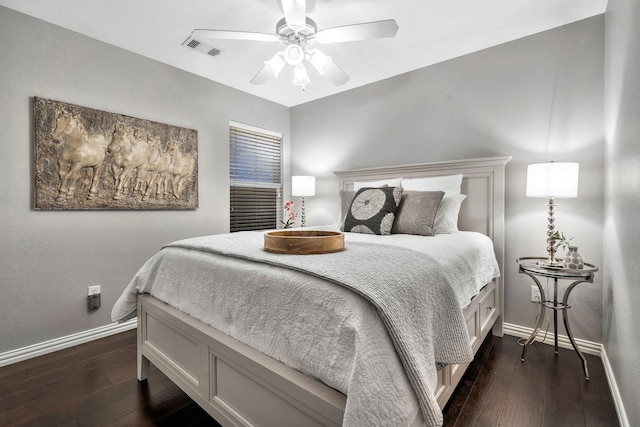 bedroom featuring ceiling fan and dark hardwood / wood-style flooring