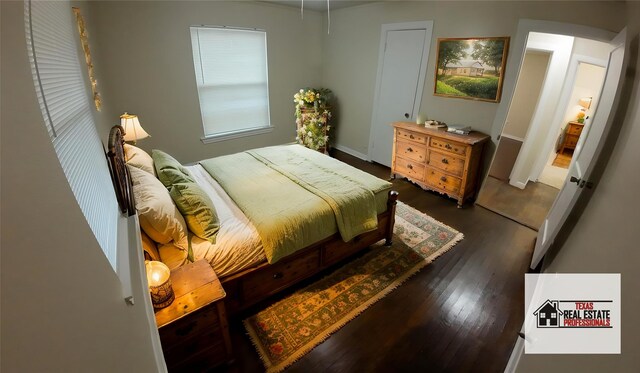 1104 Prairie Ave, Cleburne, TX 76033 - spare room with baseboards and dark wood-style flooring
