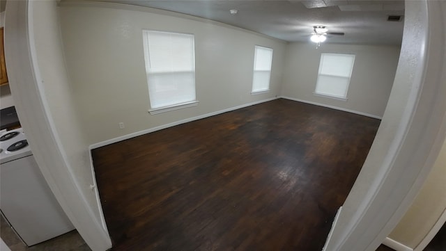 1104 Prairie Ave, Cleburne, TX 76033 - kitchen featuring a sink, dark countertops, a ceiling fan, white appliances, and brown cabinets