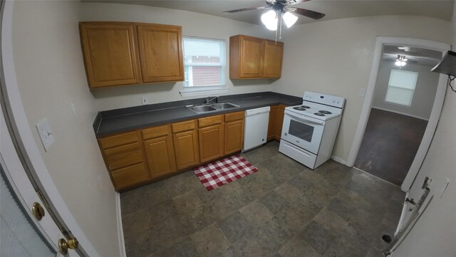 1104 Prairie Ave, Cleburne, TX 76033 - kitchen with a sink, dark countertops, baseboards, a ceiling fan, and white appliances