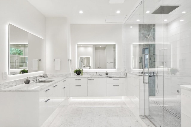 bathroom featuring vanity and an enclosed shower