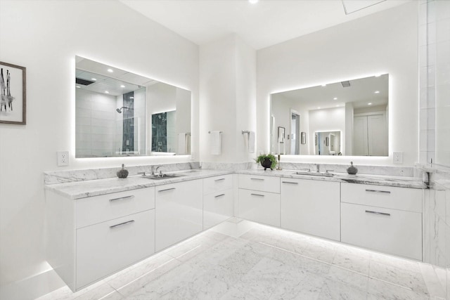 bathroom with a shower and vanity