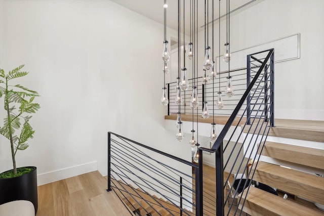 stairway featuring hardwood / wood-style floors