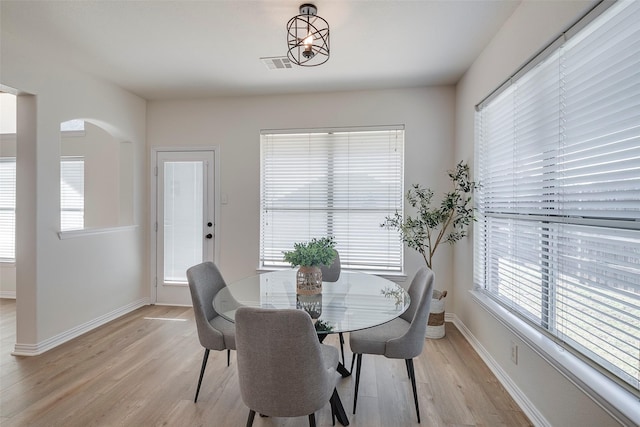 dining space featuring light hardwood / wood-style flooring and plenty of natural light