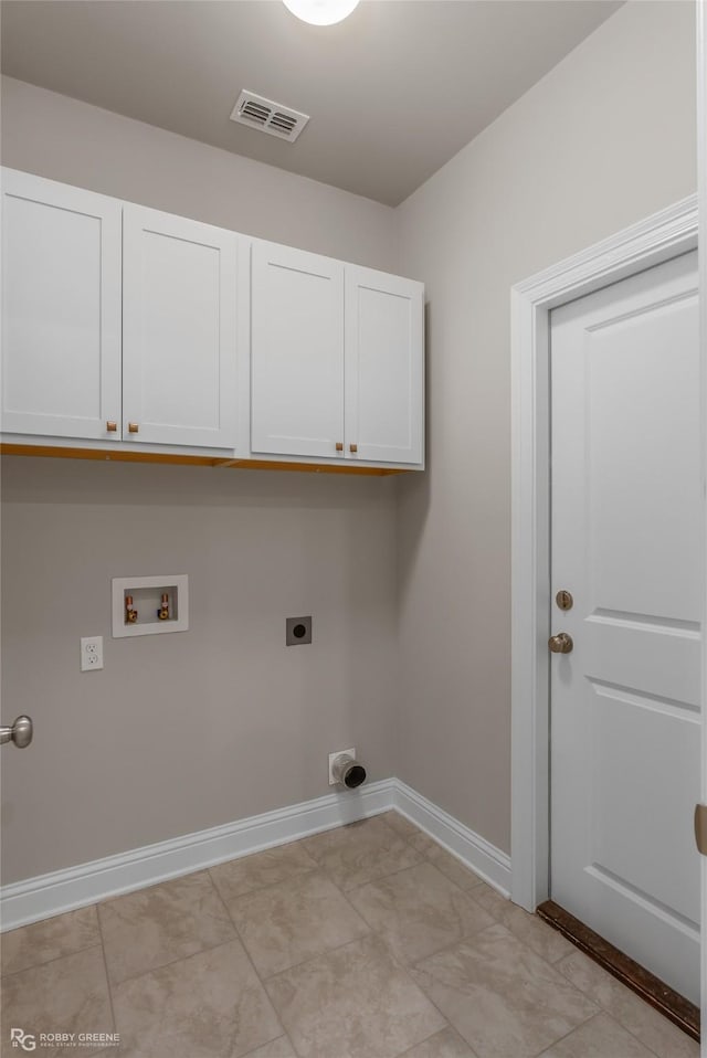 washroom featuring cabinets, hookup for an electric dryer, and hookup for a washing machine