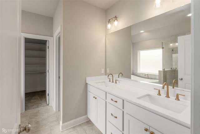 bathroom with vanity, tile patterned floors, and shower with separate bathtub