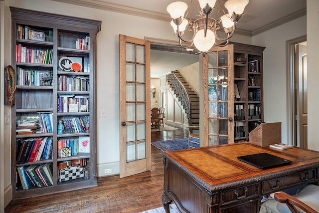 office featuring dark hardwood / wood-style flooring, ornamental molding, french doors, and an inviting chandelier