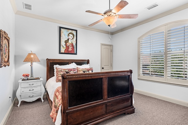 carpeted bedroom with ceiling fan and crown molding