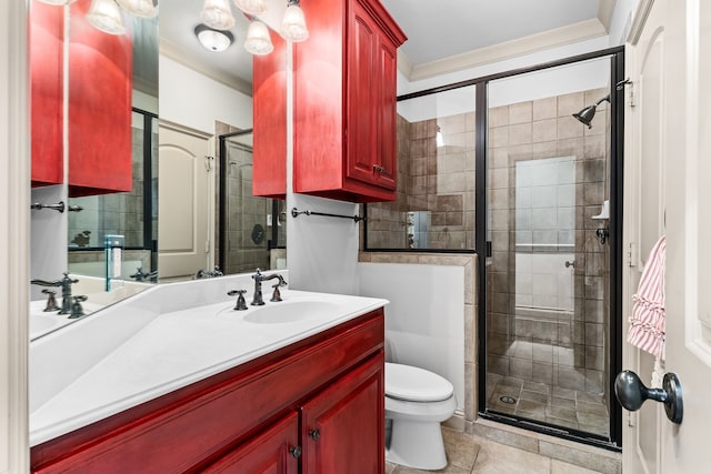 bathroom with tile patterned flooring, vanity, a shower with shower door, and ornamental molding