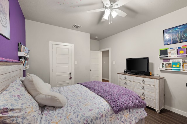 bedroom with dark wood-type flooring and ceiling fan