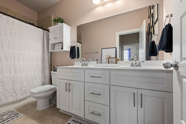 bathroom featuring a shower with curtain, vanity, tile patterned floors, and toilet