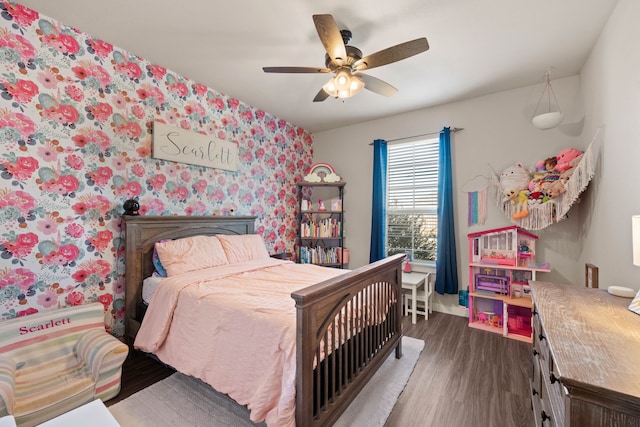 bedroom with dark hardwood / wood-style floors and ceiling fan