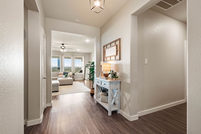 hallway with dark wood-type flooring