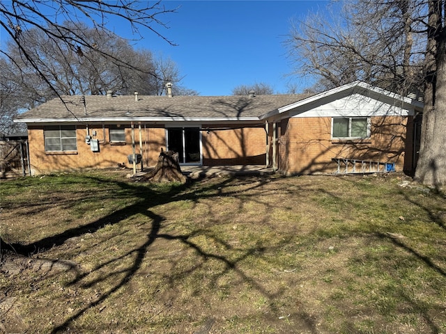 back of house with a yard