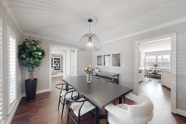 dining area with an inviting chandelier, crown molding, and dark hardwood / wood-style floors