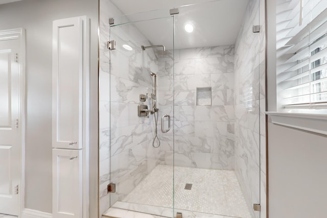 bathroom featuring an enclosed shower