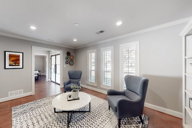 living area featuring ornamental molding and wood-type flooring