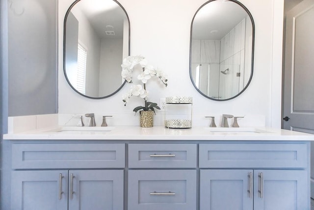 bathroom featuring vanity and a shower