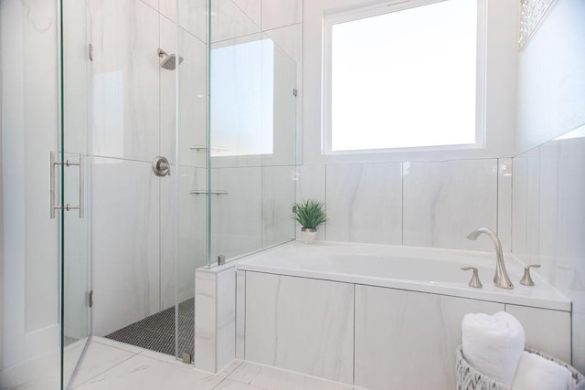 bathroom with shower with separate bathtub