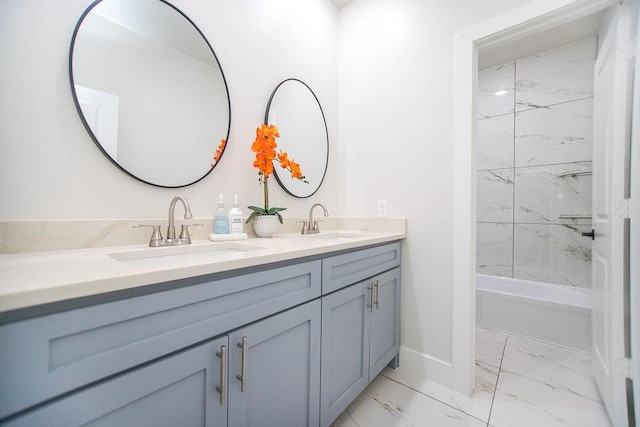 bathroom with tiled shower / bath and vanity