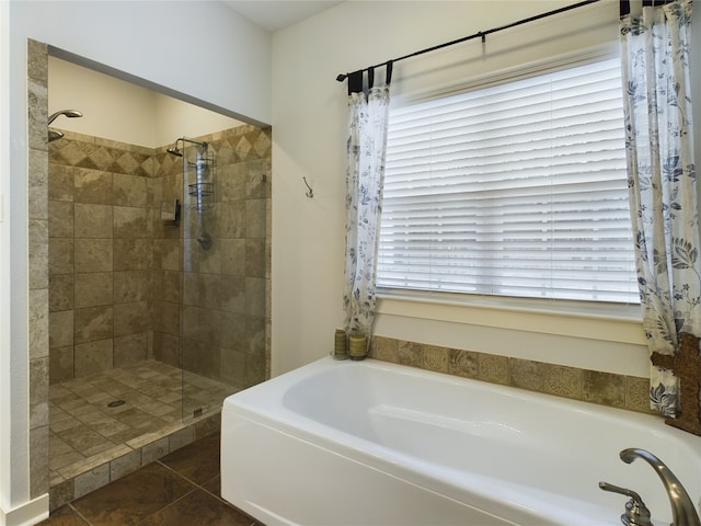 bathroom with a wealth of natural light, tile patterned floors, and plus walk in shower