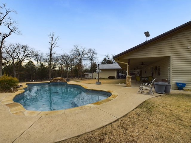 view of swimming pool with a patio