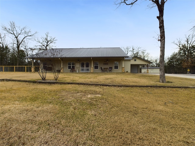 view of front of property with a garage and a front yard