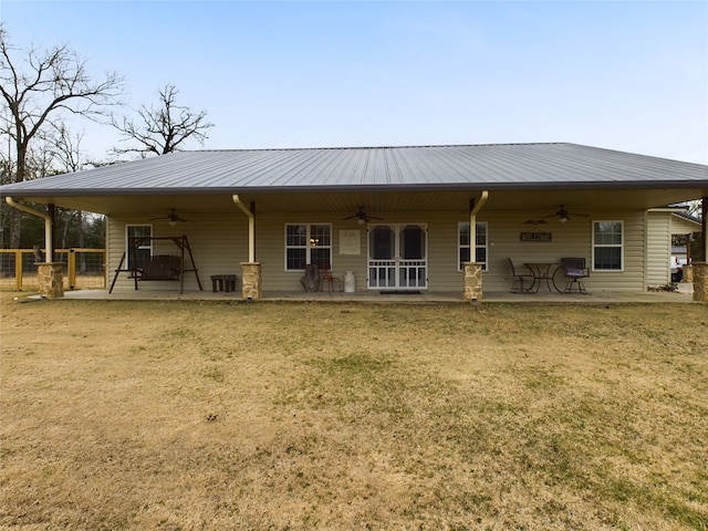 back of property featuring a patio area, a yard, and ceiling fan